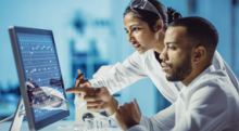 image of laboratory professionals image of laboratory professionals looking at computer screen in a lab